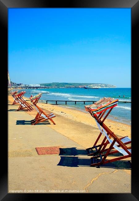 Early morning deckchairs. Framed Print by john hill