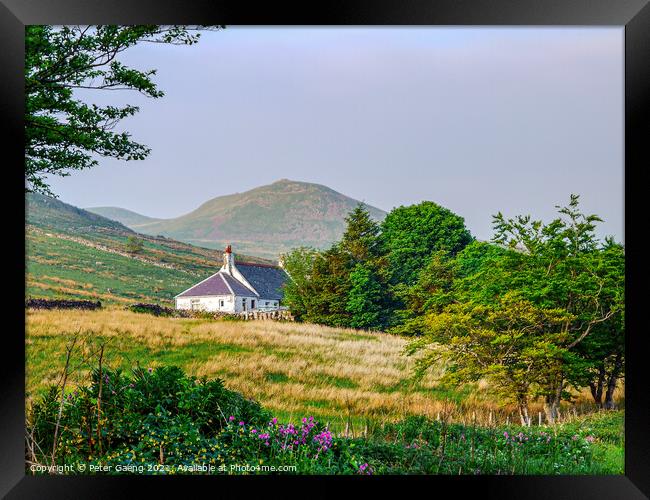 Cottage in the Scottish mountains  Framed Print by Peter Gaeng