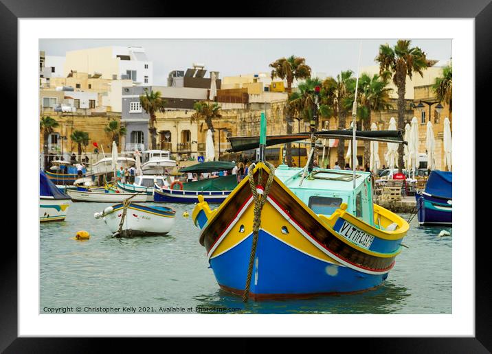A small boats moored in marsaxlokk bay Framed Mounted Print by Christopher Kelly