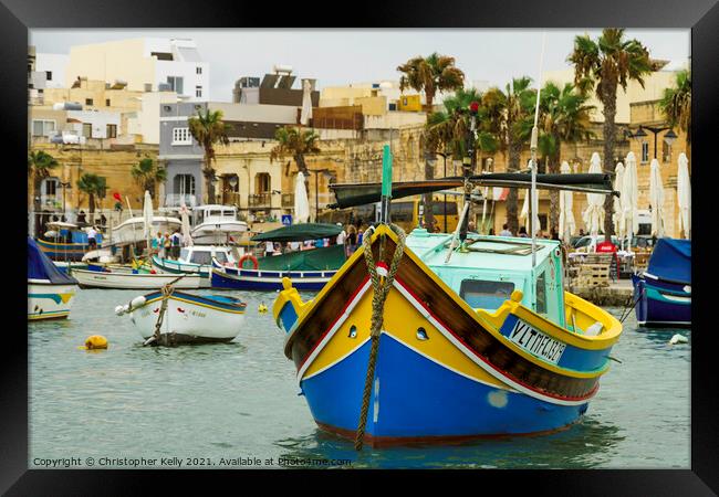 A small boats moored in marsaxlokk bay Framed Print by Christopher Kelly