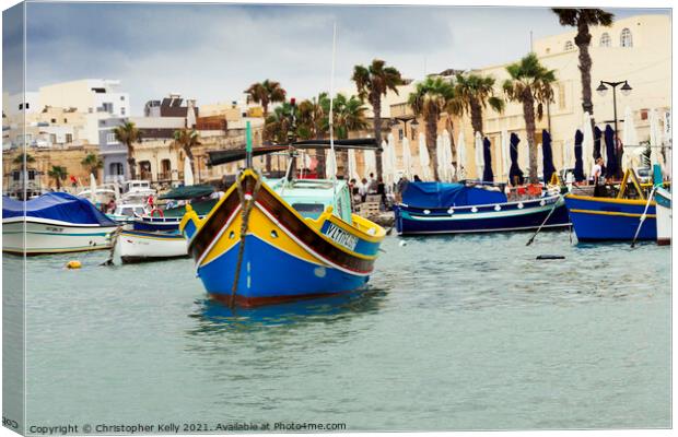 Moored boats in Marsaxlokk Bay  Canvas Print by Christopher Kelly