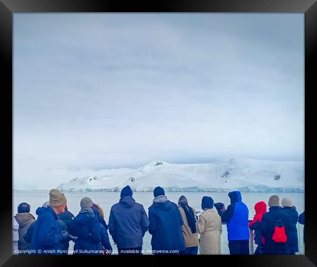 a group of people watching glacier in Antarctica Framed Print by Anish Punchayil Sukumaran