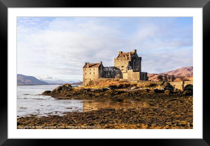 Winter Sunshine On Eilean Donan Castle in the Scotish Highlands Framed Mounted Print by Peter Greenway