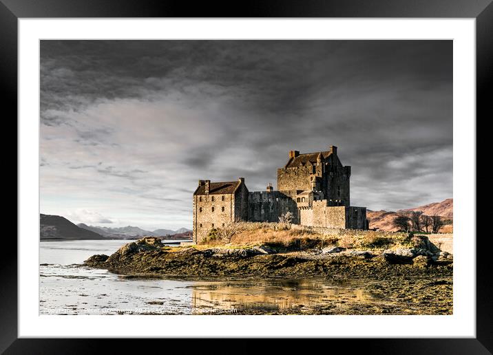 Winters Day At Eilean Donan Castle In The Scottish Highlands Framed Mounted Print by Peter Greenway