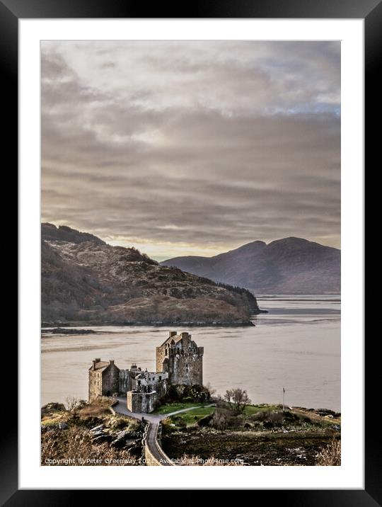 Eilean Donan Castle in the Scottish Highlands From The Hills Framed Mounted Print by Peter Greenway