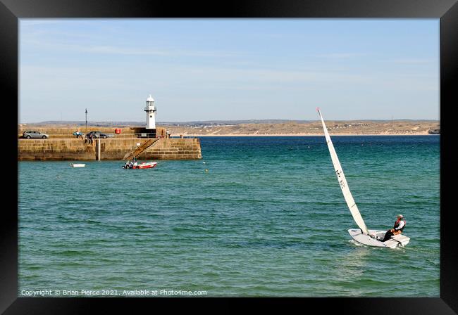 Sailing in St Ives Harbour Framed Print by Brian Pierce
