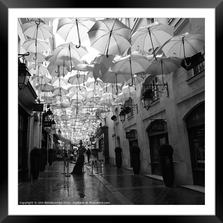 Umbrella street in Paris in black and white Framed Mounted Print by Ann Biddlecombe