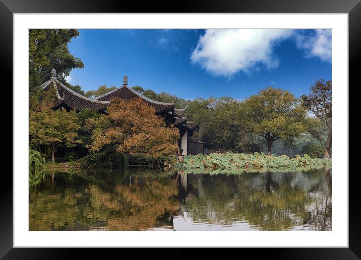 Asian temples on placid lake during late autumn  Framed Mounted Print by Thomas Baker