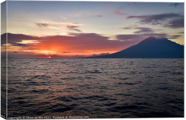 Sunset on the sea with a volcano in Indonesia Canvas Print by Chun Ju Wu