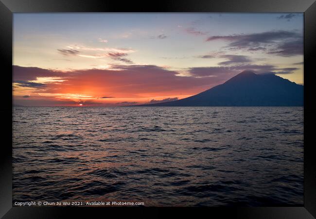 Sunset on the sea with a volcano in Indonesia Framed Print by Chun Ju Wu