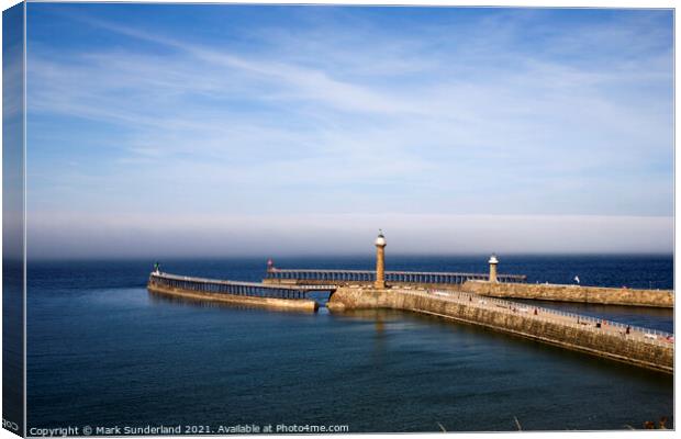 West and East Piers with a Sea Mist Looming at Whitby Canvas Print by Mark Sunderland