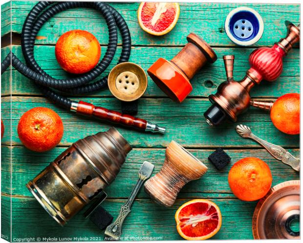 Smoking hookah with grapefruit flavor Canvas Print by Mykola Lunov Mykola