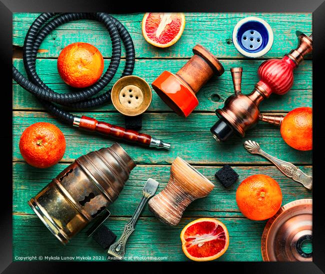 Smoking hookah with grapefruit flavor Framed Print by Mykola Lunov Mykola