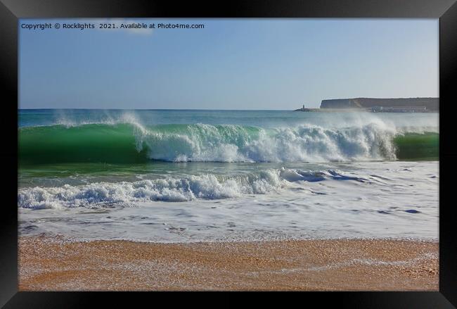 Waves crashing onto a sandy beach in the algarve Framed Print by Rocklights 