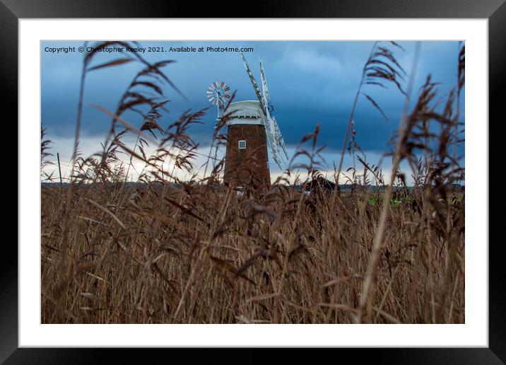 Horsey Windpump through the reeds Framed Mounted Print by Christopher Keeley