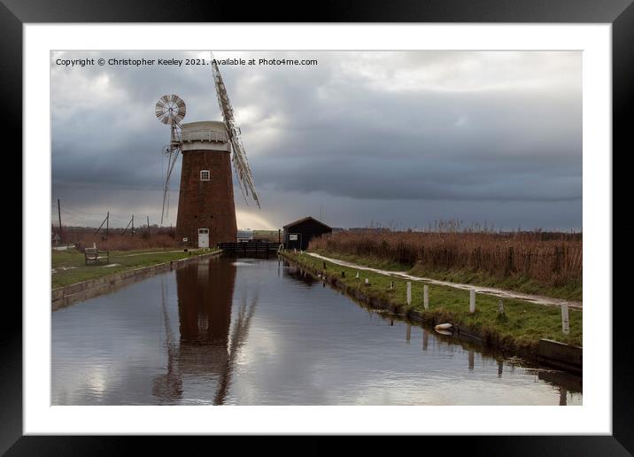 Cloudy skies over Horsey Mill Framed Mounted Print by Christopher Keeley