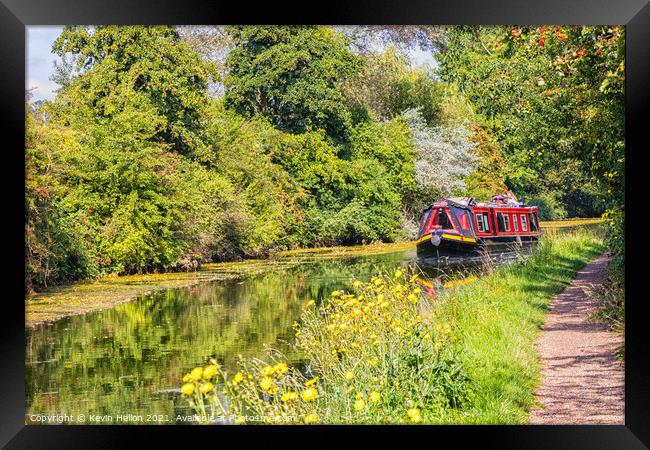 A narrowboat makes its way along the Grand Union canal  Framed Print by Kevin Hellon