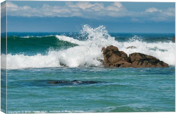 Waves rolling onto a rocky Cornish Beach Canvas Print by Brian Pierce