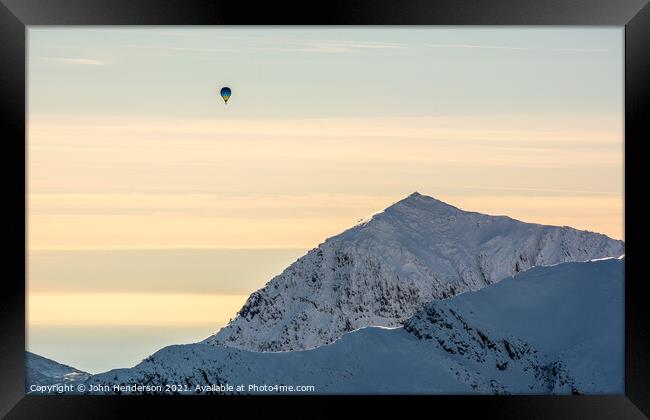 Majestic Hot Air Balloon Soaring over Snowdon Framed Print by John Henderson