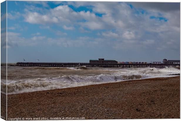 Hastings Pier with a Rough Sea. Canvas Print by Mark Ward