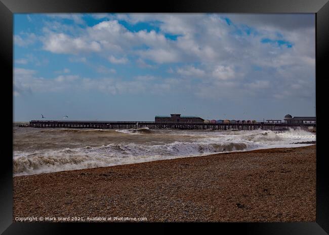 Hastings Pier with a Rough Sea. Framed Print by Mark Ward