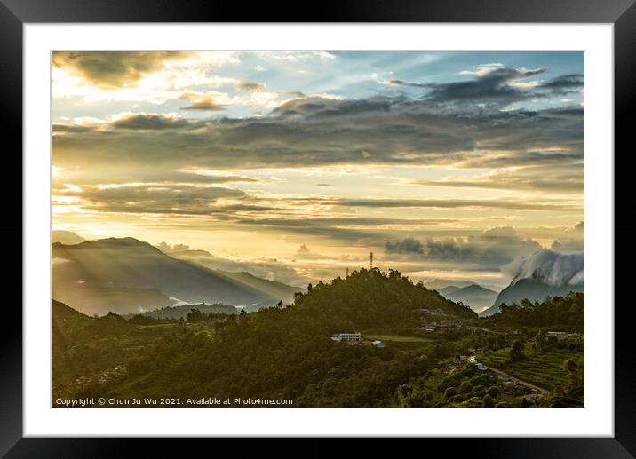 Mountains under the light of sunrise through clouds Framed Mounted Print by Chun Ju Wu