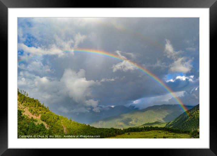 A rainbow among mountains in cloudy day Framed Mounted Print by Chun Ju Wu