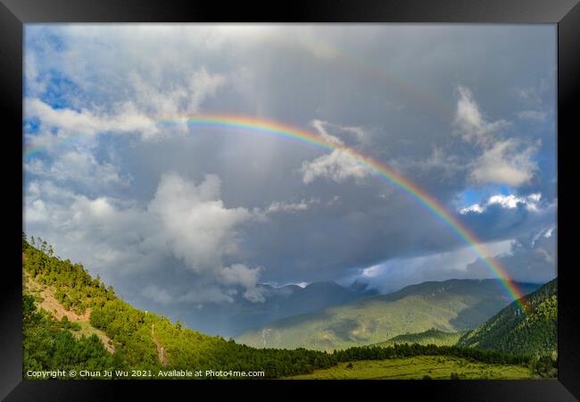 A rainbow among mountains in cloudy day Framed Print by Chun Ju Wu