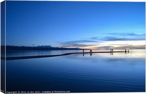 Peaceful blue lake at sunset time Canvas Print by Chun Ju Wu