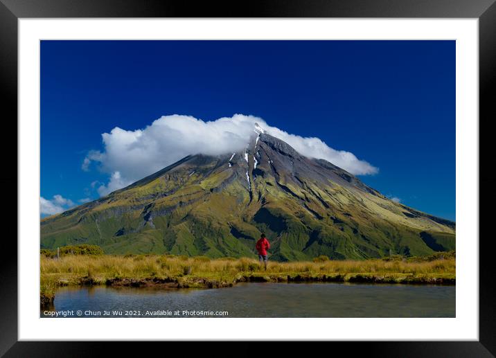 A man in front of Mount Taranaki in New Plymouth, New Zealand Framed Mounted Print by Chun Ju Wu