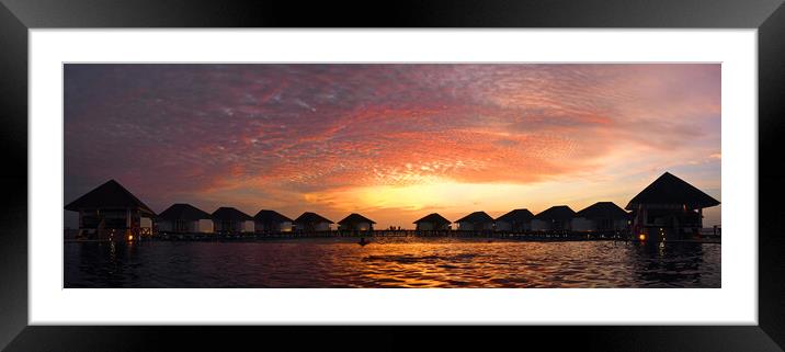 Maldives sunset over water bungelows Framed Mounted Print by mark humpage