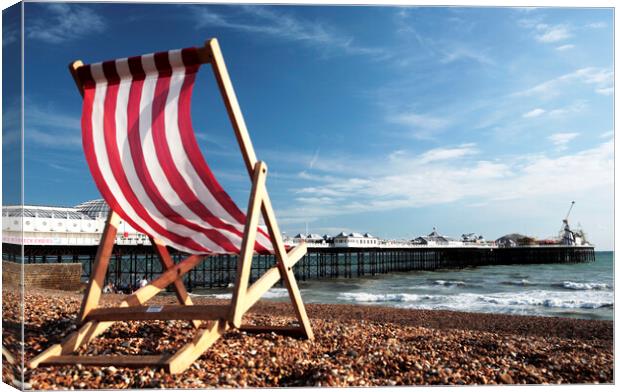 Striped Deckchair on Brighton Beach, England Canvas Print by Neil Overy