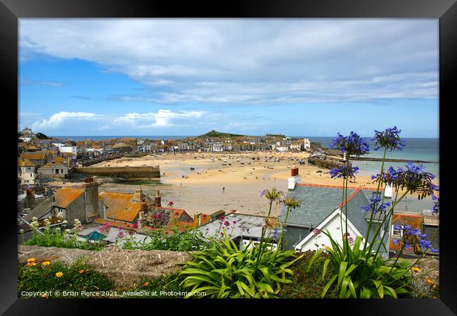 View over the rooftops to St Ives Harbour Framed Print by Brian Pierce
