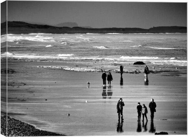 North Norfolk coast with people walking on beach black and white Canvas Print by mark humpage