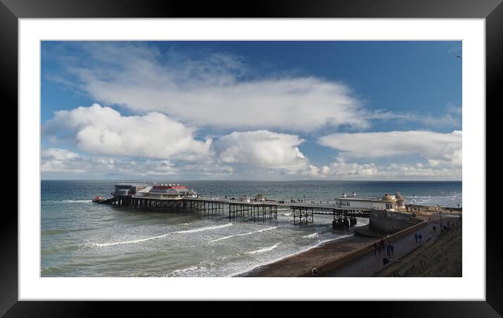 Cromer Pier with lifeboat sun and clouds Framed Mounted Print by mark humpage