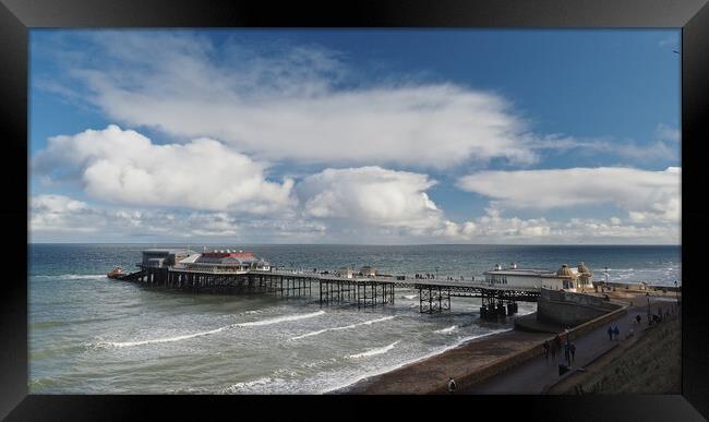 Cromer Pier with lifeboat sun and clouds Framed Print by mark humpage