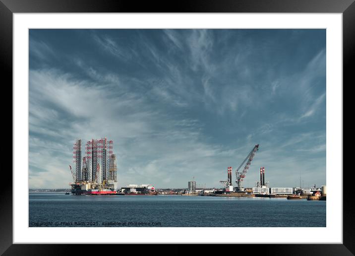 Oil and Wind power rigs in Esbjerg harbor. Denmark Framed Mounted Print by Frank Bach