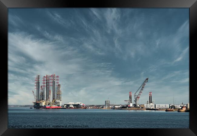 Oil and Wind power rigs in Esbjerg harbor. Denmark Framed Print by Frank Bach