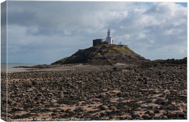Mumbles lighthouse at low tide Canvas Print by Bryn Morgan