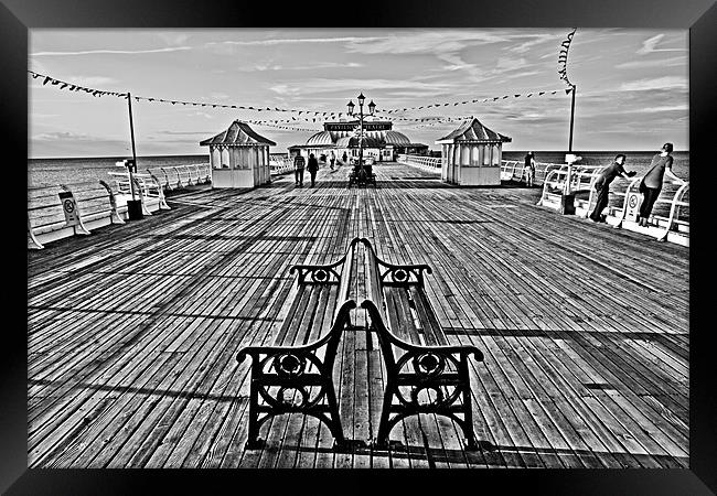 Strolling on Cromer Pier Framed Print by Paul Macro