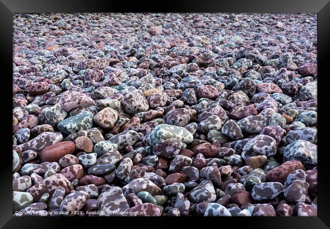 Pebbles on the seashore Framed Print by Joy Walker