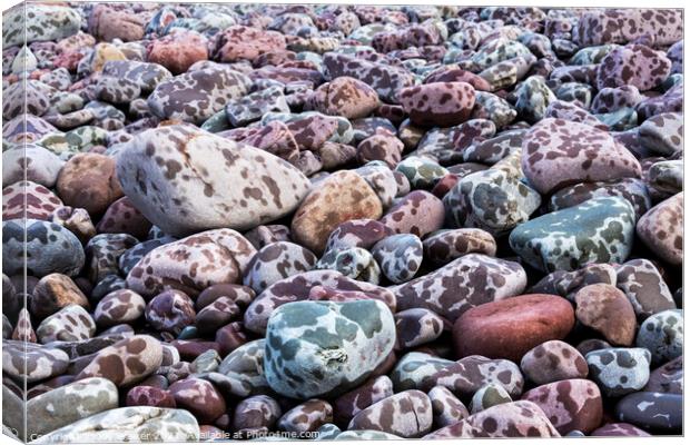Pebbles on the seashore during a rain storm Canvas Print by Joy Walker