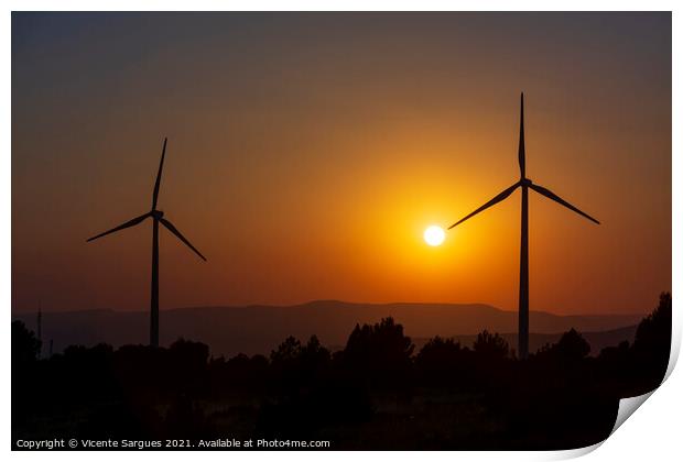 Two windmills facing the sun at sunset Print by Vicente Sargues