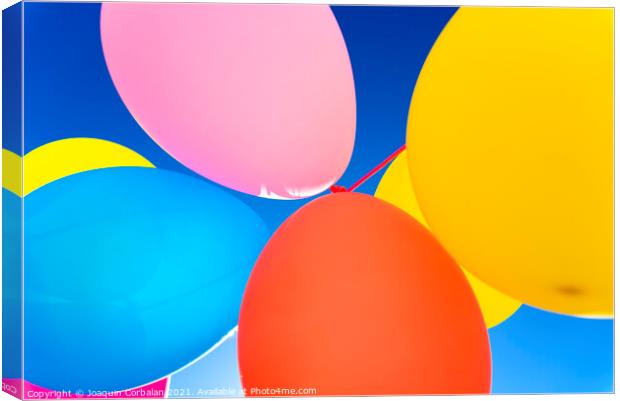 Colorful balloons inflated against the sun, festive and joyful colorful background. Canvas Print by Joaquin Corbalan