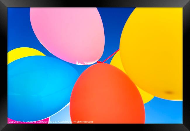 Colorful balloons inflated against the sun, festive and joyful colorful background. Framed Print by Joaquin Corbalan
