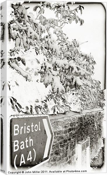 Bristol/Bath Road Sign In the Snow Canvas Print by John Miller