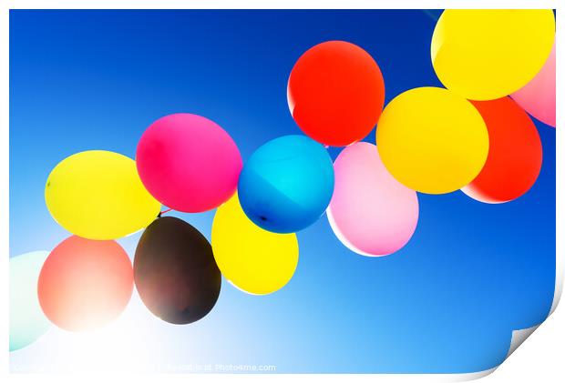 Colorful balloons inflated against the sun, festive and joyful c Print by Joaquin Corbalan