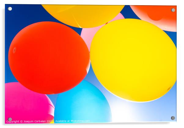 Pretty sunlit solid color balloons viewed from below with blue s Acrylic by Joaquin Corbalan