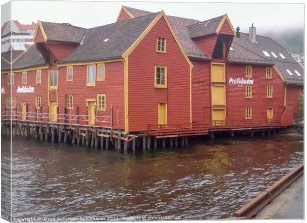 Harbour of Bergan Norway ,beautiful red house near  the pier Canvas Print by Anish Punchayil Sukumaran