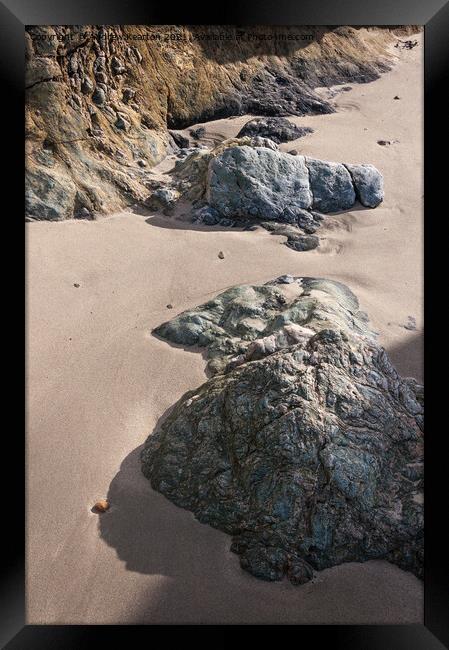 Soft sand and textured rocks Framed Print by Andrew Kearton